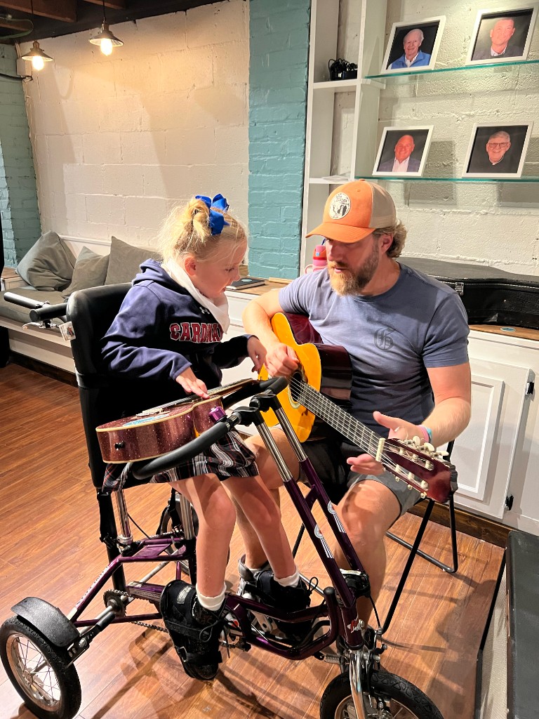 Friends rocking out with electric guitars