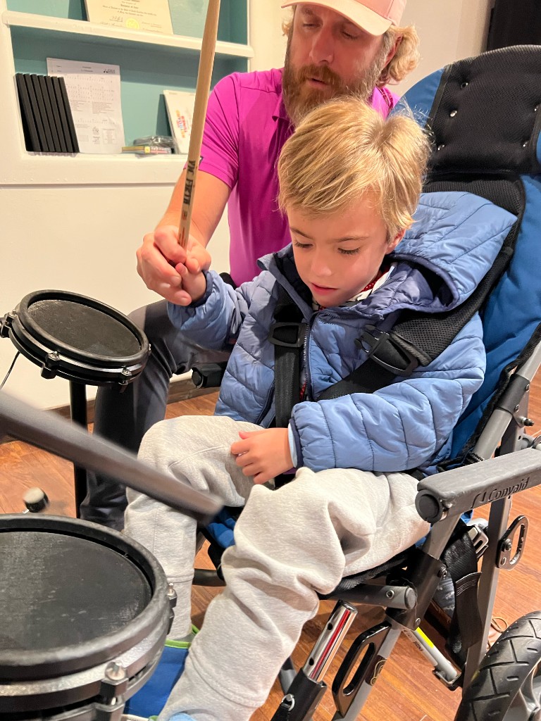 Guided drumming lesson with adaptive seating